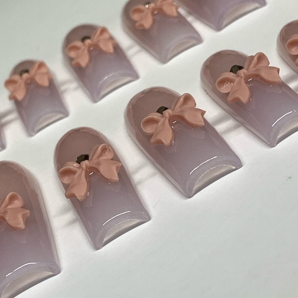French Ombre Acrylic Nails with Nude Bows and Crystals